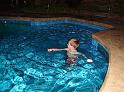 zack in pool at night